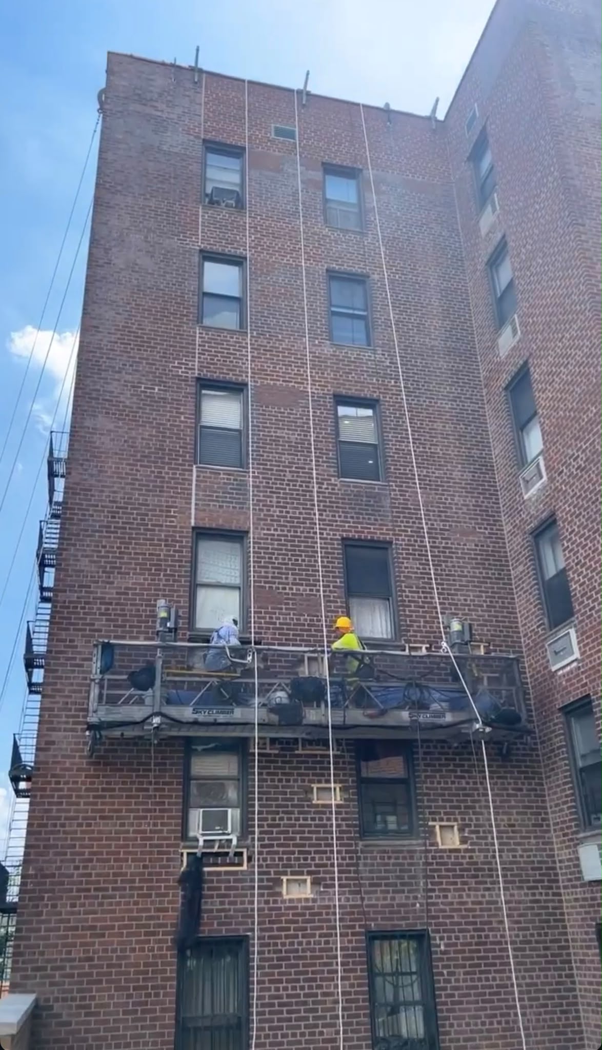 Facade work on brick apartment building